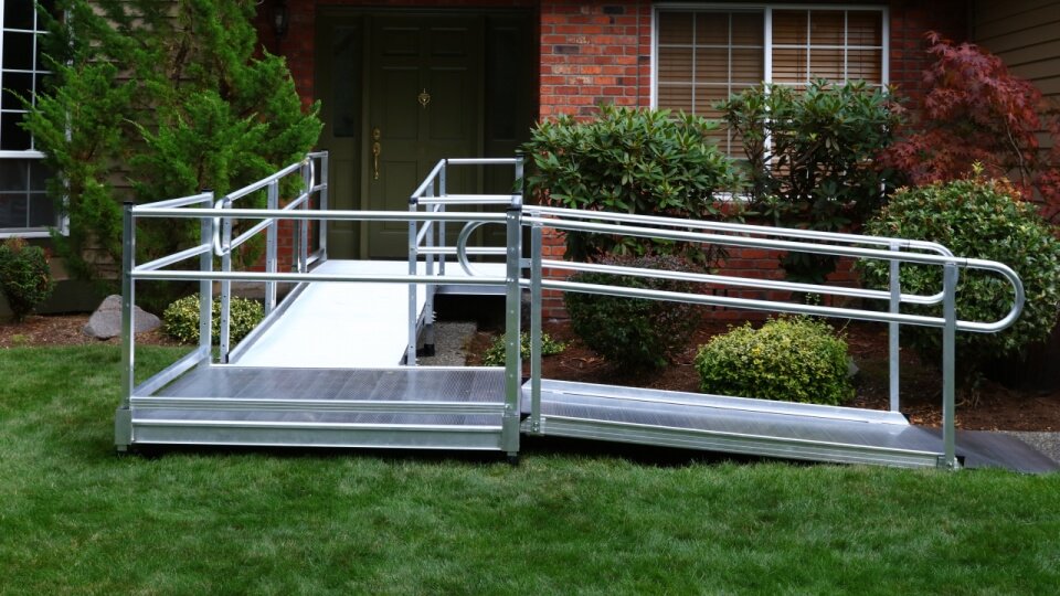 Photo of a semi-permanent or modular ramp for a wheelchair.
